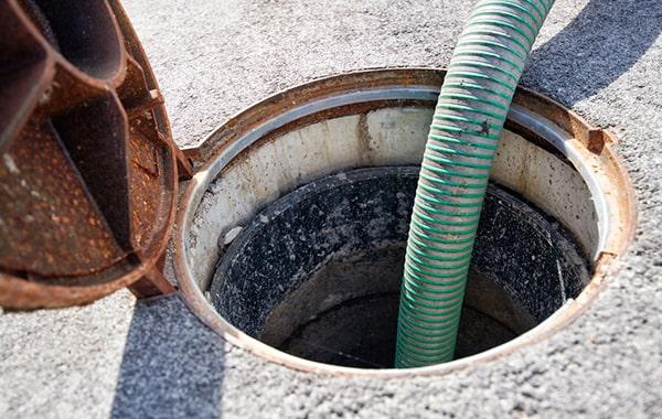 foul odors, slow draining pipes sinks, and grease buildup in the trap are all signs that grease trap pumping services are needed