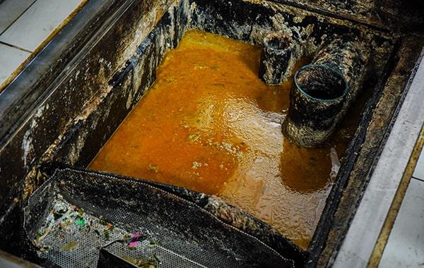 grease trap cleaning helps prevent grease and oil from entering the drain system, thus reducing the risk of ecological contamination